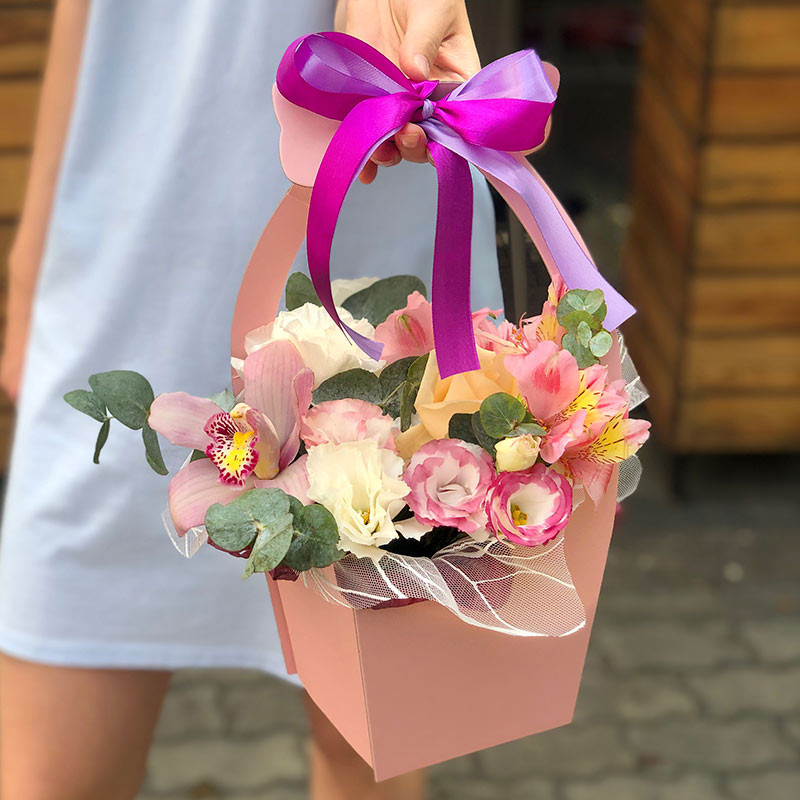 Pink basket with flowers photo