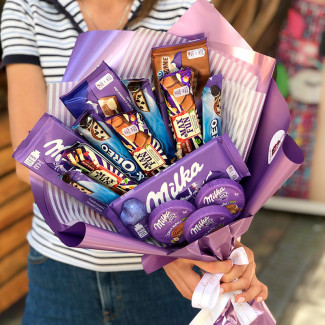 Bouquet with chocolate milka photo
